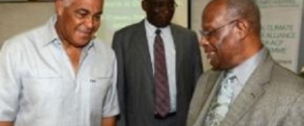 Water, Land, Environment and Climate Change Minister, Robert Pickersgill (left), I discussions with CCCCC Executive Director, Dr. Kenrick Leslie (right) (JIS PHOTO)