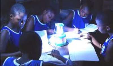 Children using solar lamp to study in a remote village Credit: CARICOM Newsletter